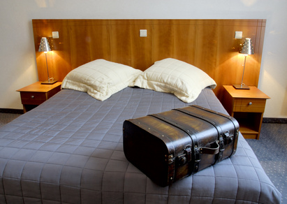 hotel room with suitcase