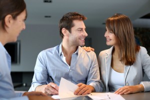 Couple meeting architect for plans of future home